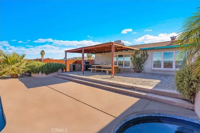 swimming pool view with a garden space