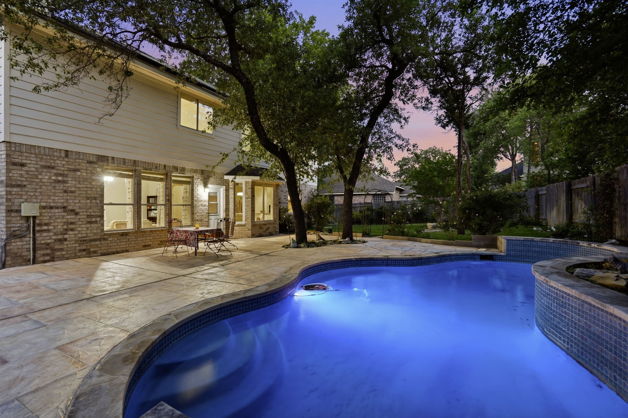 9113 Evening Primrose Path Austin, TX 78750 - Photo 29 of 34 a view of swimming pool with outdoor seating and trees in the background