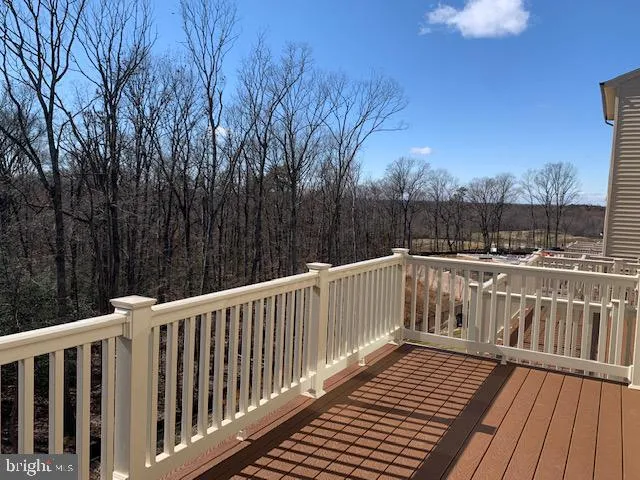 a view of balcony with wooden floor