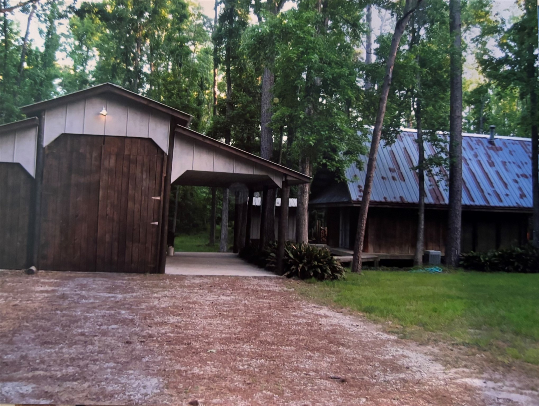 a front view of house with yard and trees
