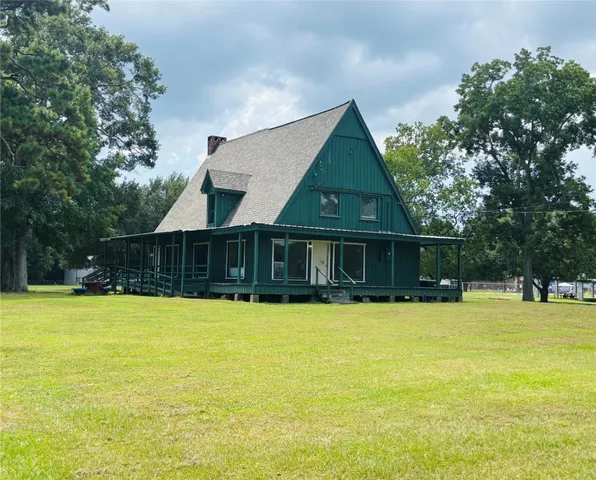 a front view of a house with swimming pool