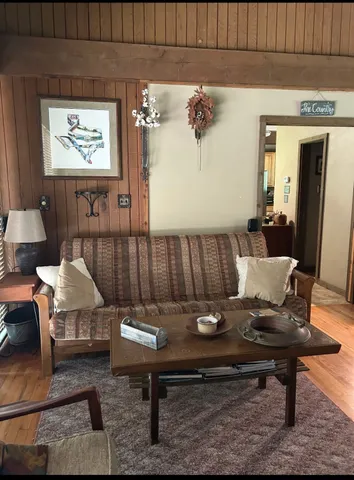 a living room with furniture and a table