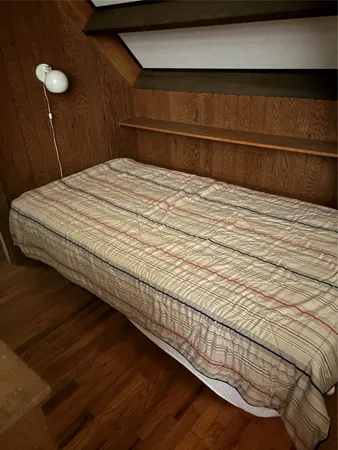 a bedroom with a bed and a cabinets