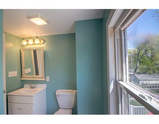 161 Nantasket Road Hull, MA 02045 - Photo 18 of 26 a bathroom with a sink a toilet and mirror