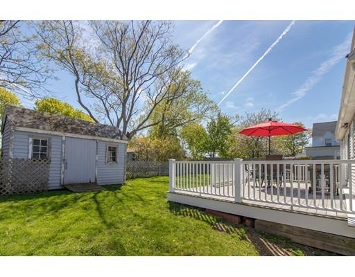 161 Nantasket Road Hull, MA 02045 - Photo 21 of 26 a view of a chair and table and backyard with wooden fence