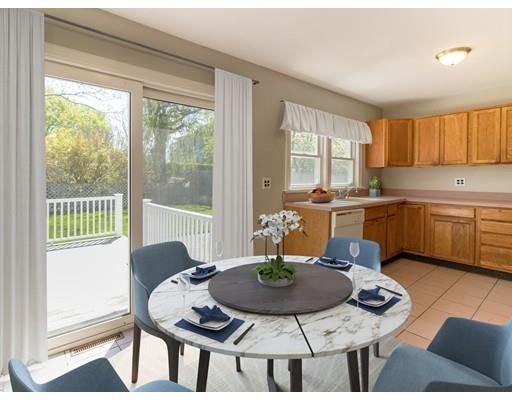 161 Nantasket Road Hull, MA 02045 - Photo 8 of 26 a kitchen with a stove a table and chairs