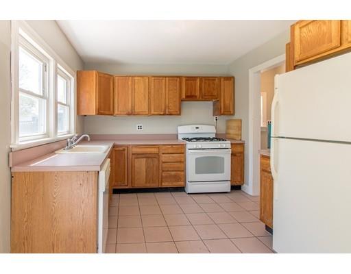 161 Nantasket Road Hull, MA 02045 - Photo 10 of 26 a kitchen with a stove a refrigerator and a sink