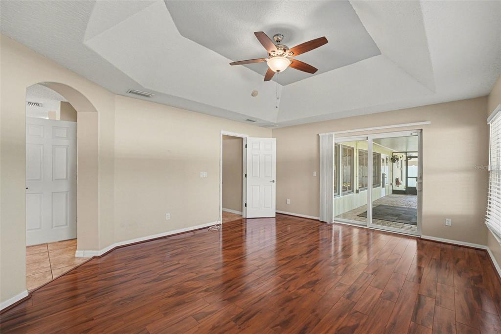 122 Costa Loop Auburndale, FL 33823 - Photo 16 of 30 an empty room with wooden floor and windows