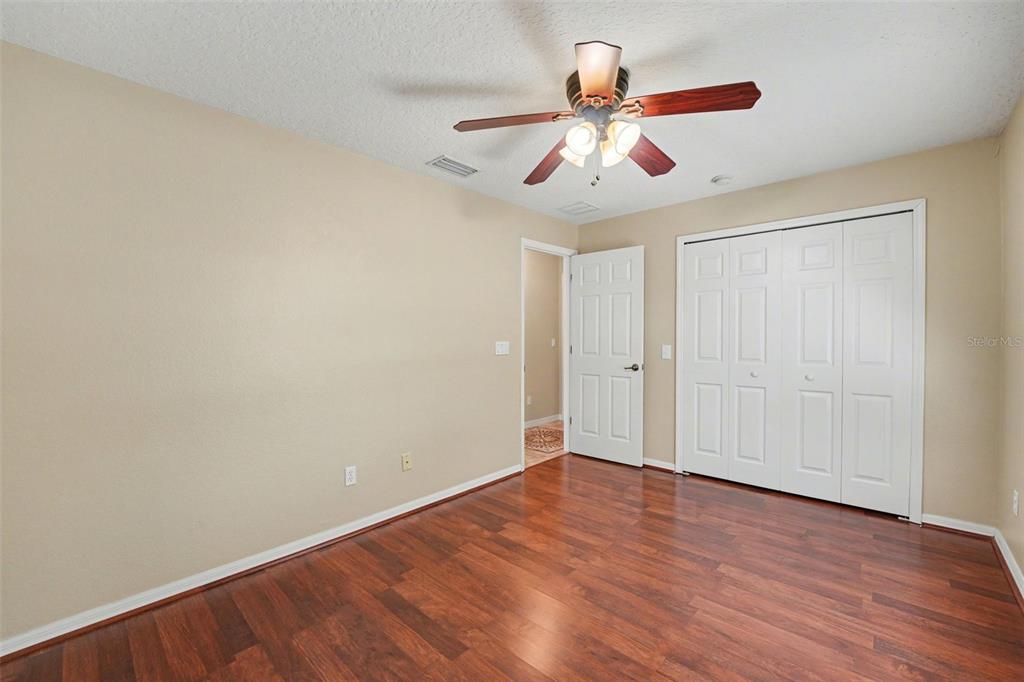 122 Costa Loop Auburndale, FL 33823 - Photo 25 of 30 a view of an empty room with wooden floor