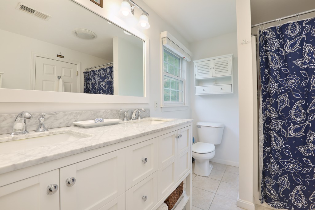139 Morgan Road Northbridge, MA 01588 - Photo 12 of 22 a bathroom with a granite countertop sink and a mirror