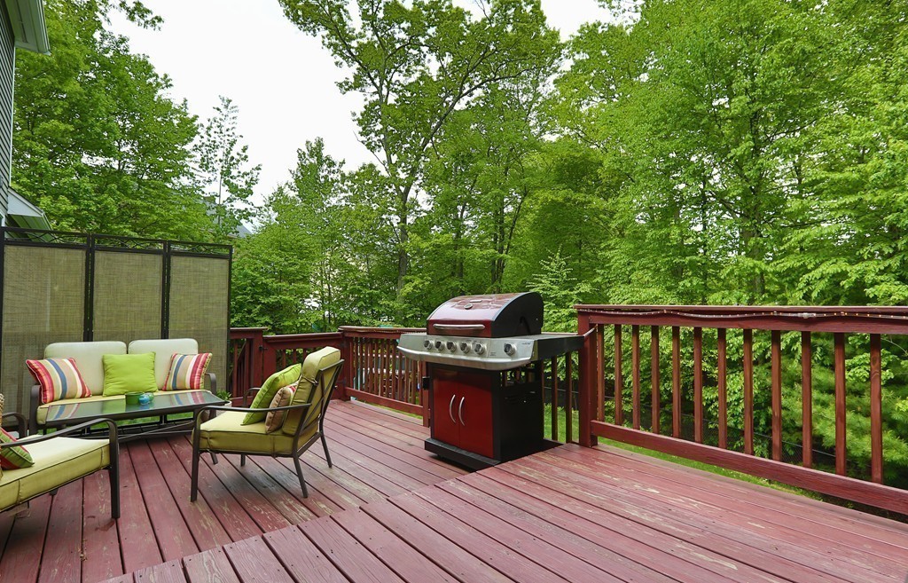 139 Morgan Road Northbridge, MA 01588 - Photo 19 of 22 a balcony with wooden floor table and chairs