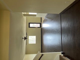 14909 Nuttall Drive Austin, TX 78724 - Photo 3 of 13 Unfurnished living room with a ceiling fan and dark wood-style floors