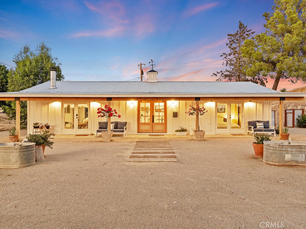a view of an ocean with furniture and chandelier