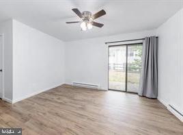 503 Bromley Estate Pine Hill, NJ 08021 - Photo 6 of 9 wooden floor in an empty room with a window
