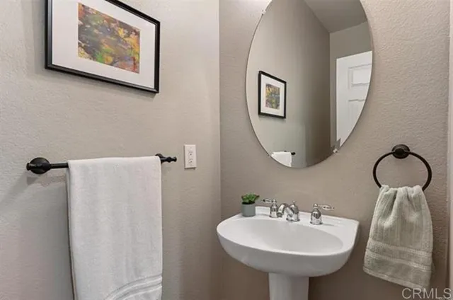 a bathroom with a sink and mirror