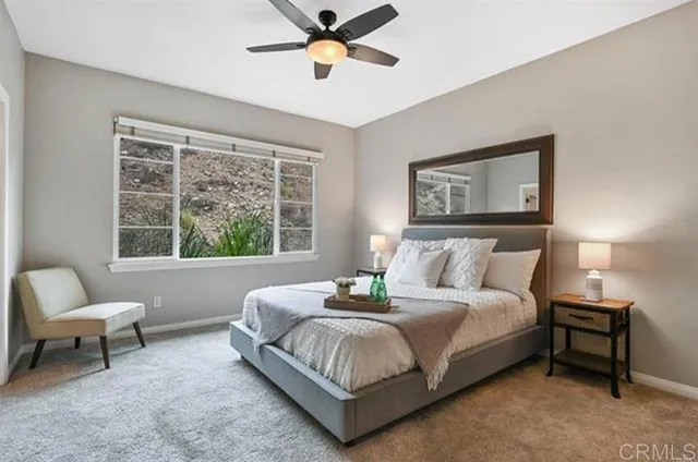 a bedroom with a bed and window