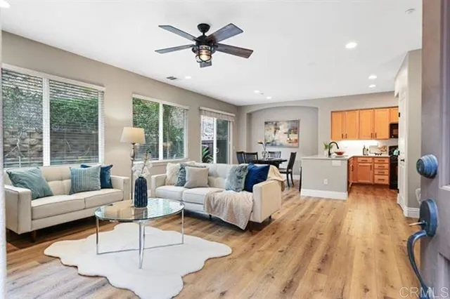 a living room with furniture and a large window