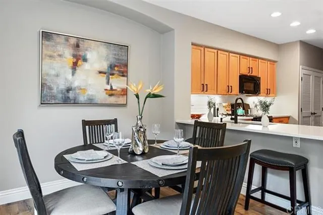 a kitchen with a dining table and chairs