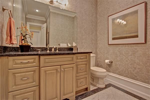 24 Hathaway Road Lexington, MA 02420 - Photo 25 of 28 a bathroom with a toilet sink and mirror