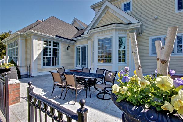 24 Hathaway Road Lexington, MA 02420 - Photo 26 of 28 a view of a house with a table and chairs