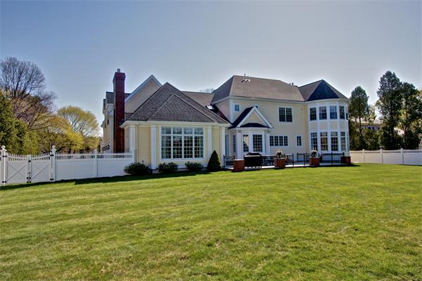 24 Hathaway Road Lexington, MA 02420 - Photo 27 of 28 a front view of a house with a yard and garage