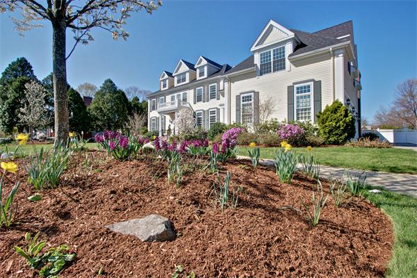 24 Hathaway Road Lexington, MA 02420 - Photo 28 of 28 a front view of a house with a garden