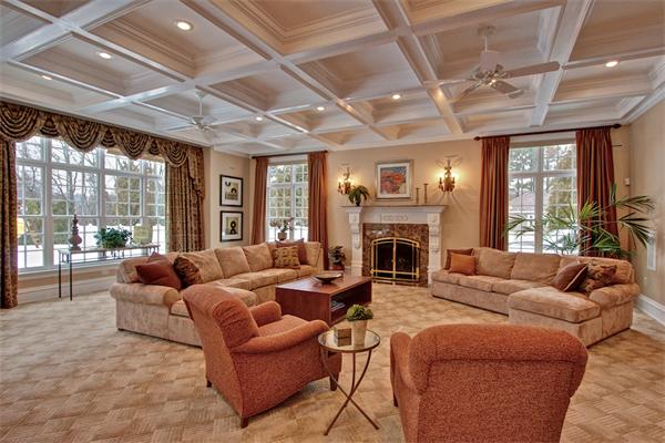 24 Hathaway Road Lexington, MA 02420 - Photo 3 of 28 a living room with furniture a fireplace and a large window