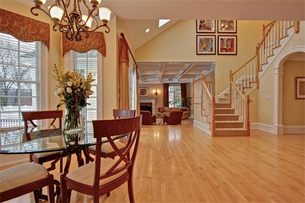 24 Hathaway Road Lexington, MA 02420 - Photo 4 of 28 a living room with furniture a two couches chair and a chandelier