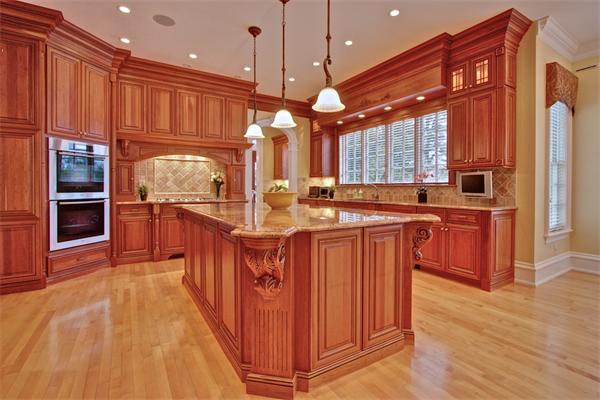 24 Hathaway Road Lexington, MA 02420 - Photo 5 of 28 a kitchen with stainless steel appliances granite countertop wooden floors wooden cabinets a window and a sink