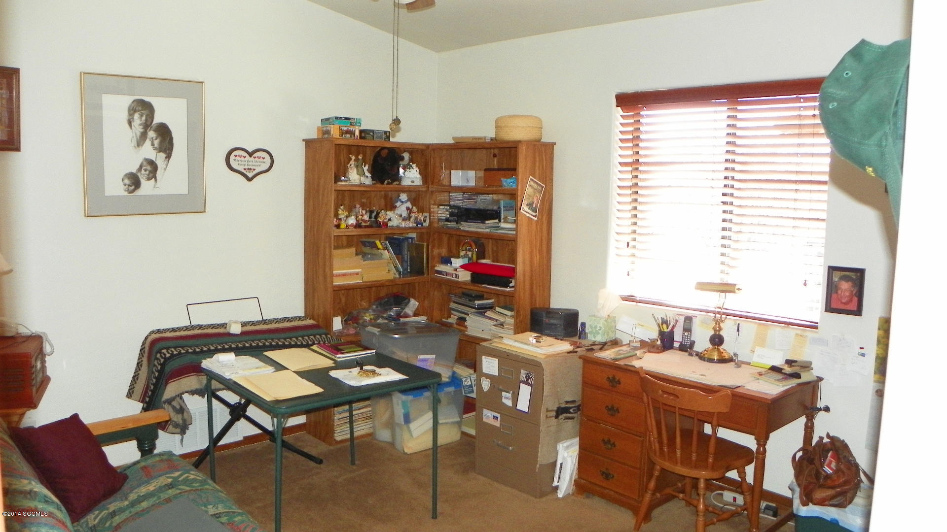 1623 Bufeo Court Rio Rico, AZ 85648 - Photo 18 of 52 a view of a workspace with furniture and a window