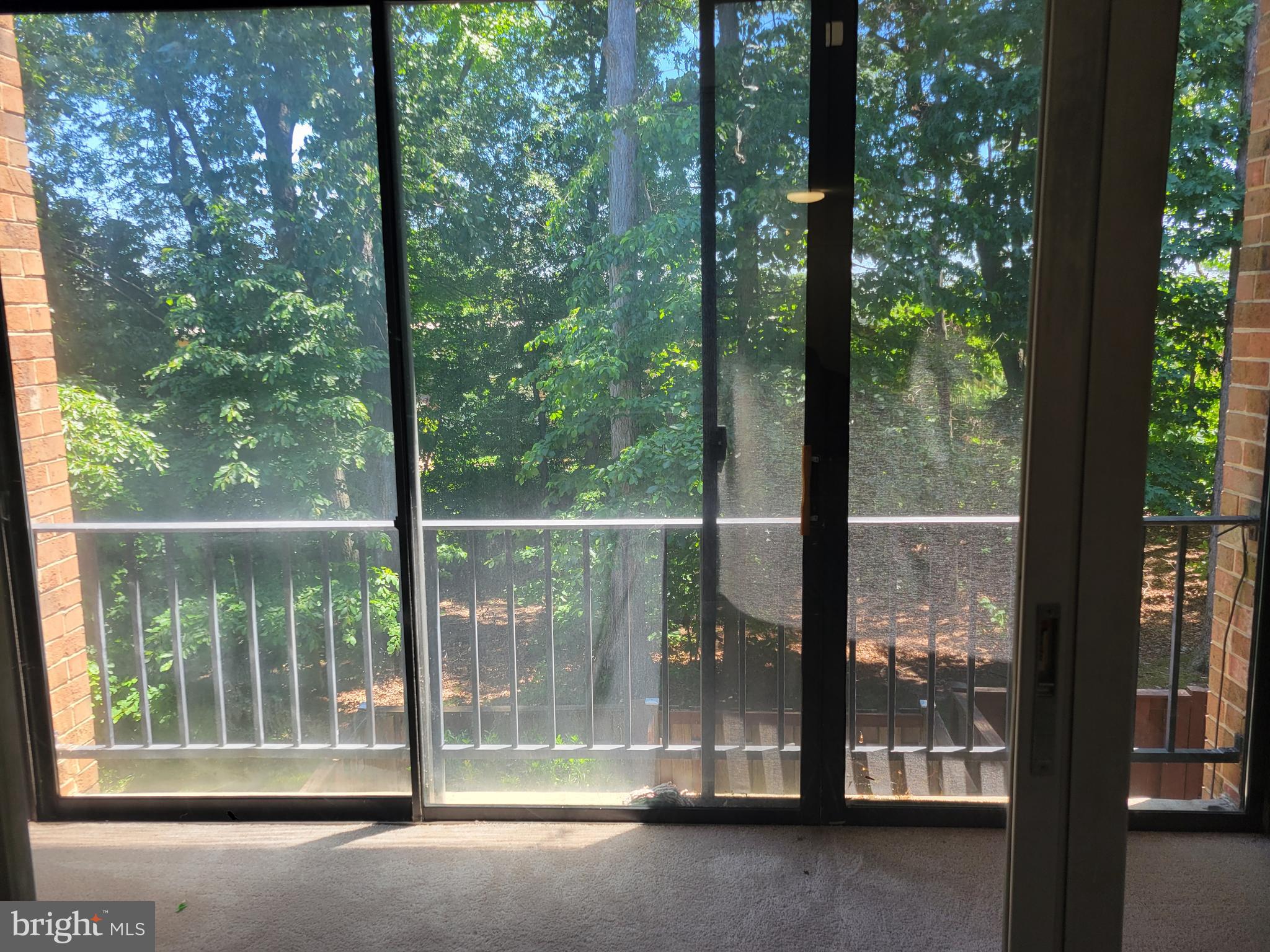 8431 Greenbelt Road Greenbelt, MD 20770 - Photo 12 of 16 a view of a glass door with a yard from a room