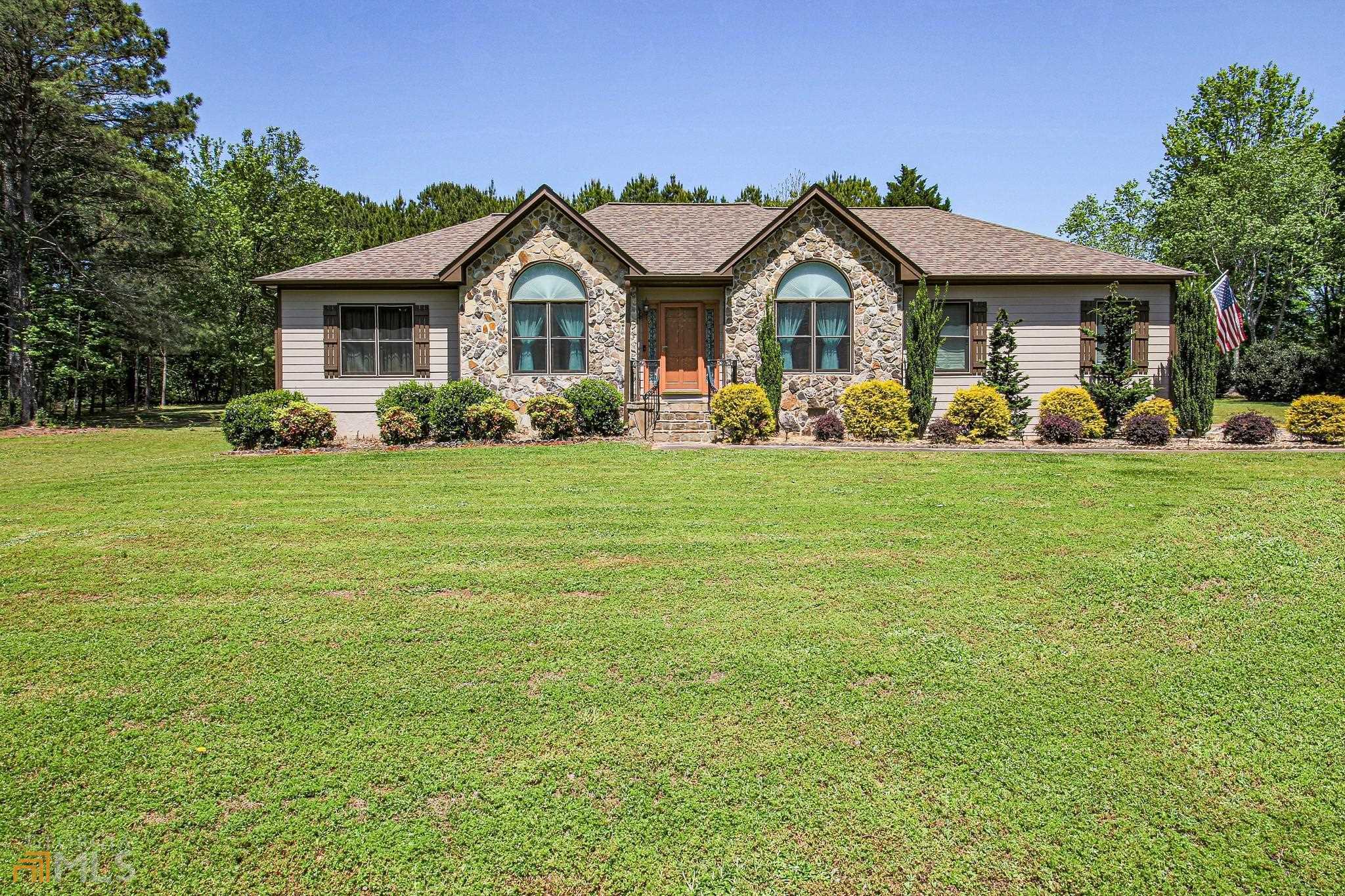 175 Red Maple Drive Hampton, GA 30228 - Photo 1 of 1 a view of a house with a big yard and large trees