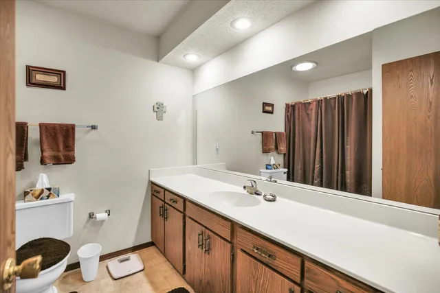 a bathroom with a sink double vanity and a mirror
