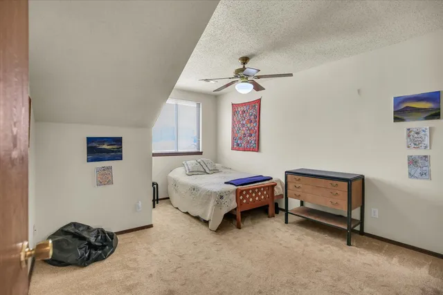 a bedroom with furniture and a window