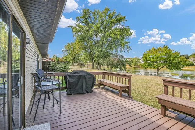 a view of a balcony with wooden floor