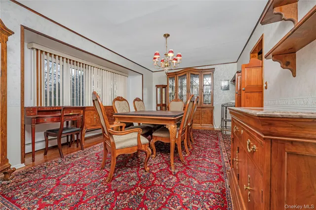 a dining room with furniture and window