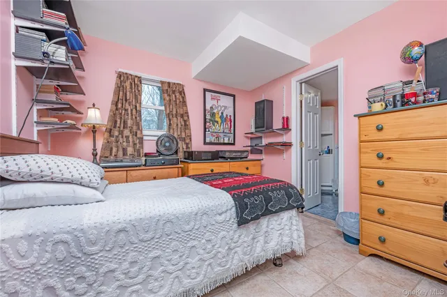 a bedroom with a bed and a cabinets