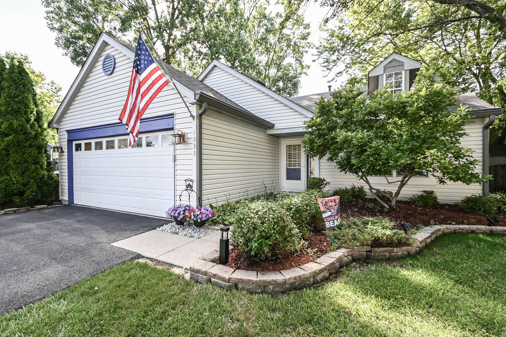1333 Regency Lane Round Lake, IL 60073 - Photo 1 of 31 a front view of a house with a yard