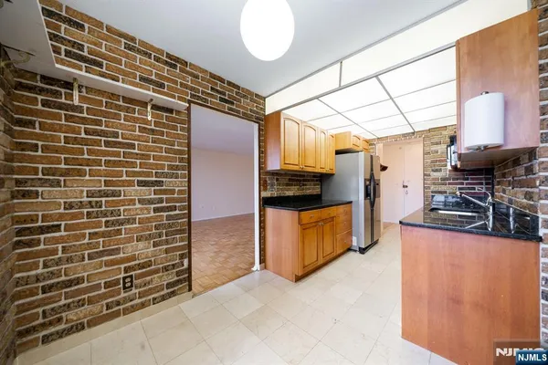 a kitchen with stainless steel appliances a sink and counter space