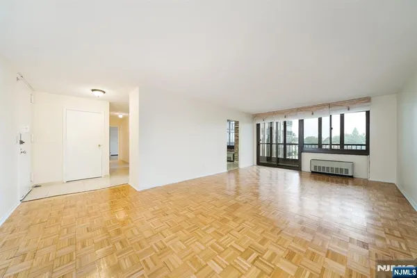 a view of an empty room with a window