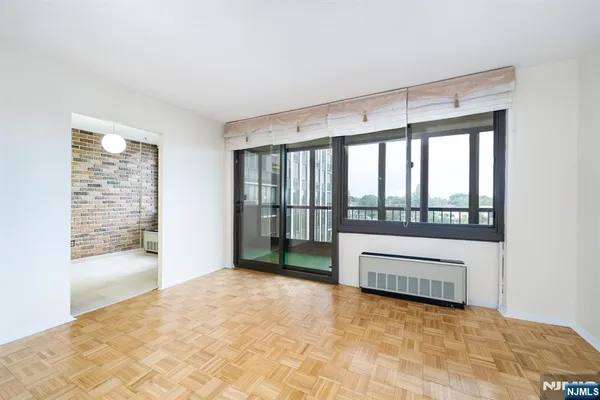 a view of an empty room with a window
