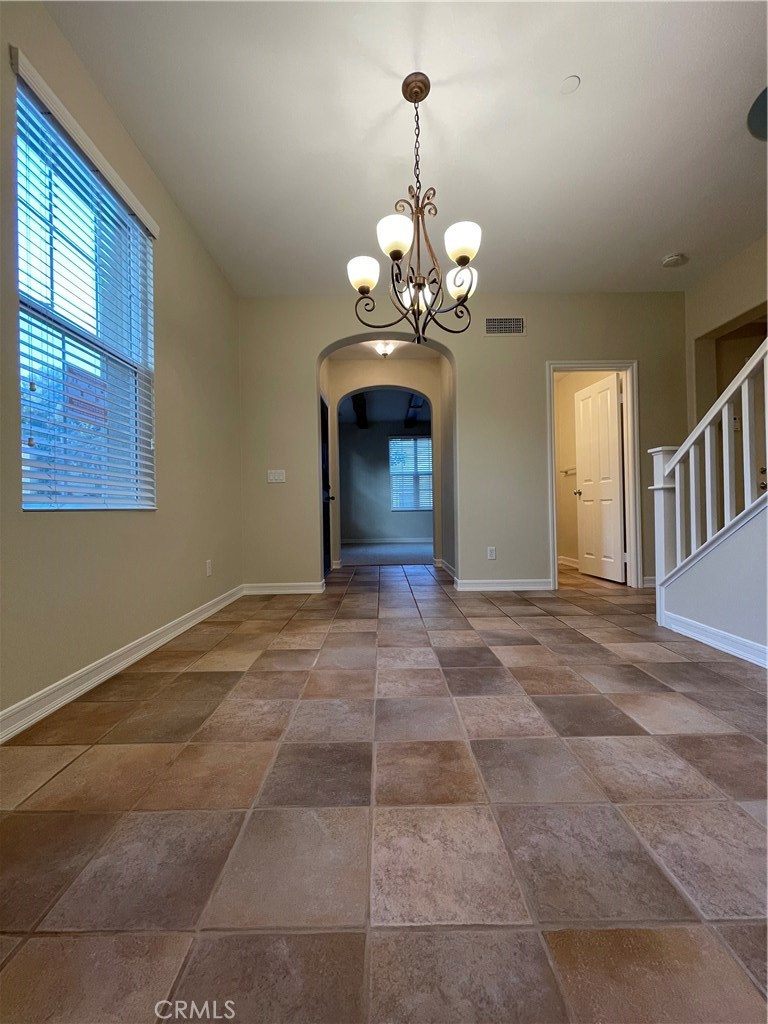 20 Arborside Irvine, CA 92603 - Photo 11 of 45 a view of a chandelier in big room with windows
