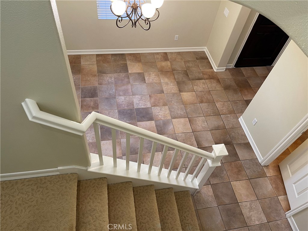 20 Arborside Irvine, CA 92603 - Photo 21 of 45 a view of staircase with railing and white walls