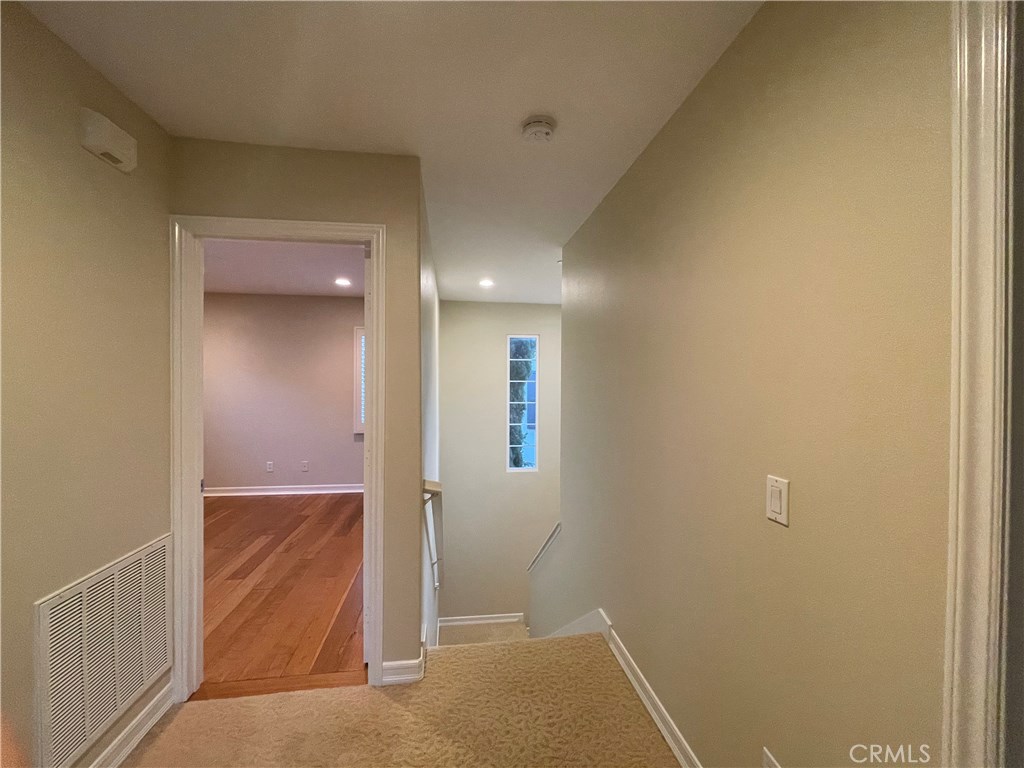 20 Arborside Irvine, CA 92603 - Photo 26 of 45 an empty room with an entrance to other room