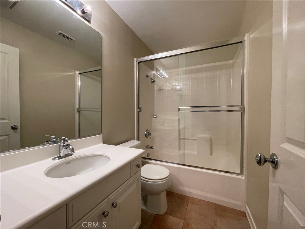 20 Arborside Irvine, CA 92603 - Photo 30 of 45 a bathroom with a shower sink mirror and toilet