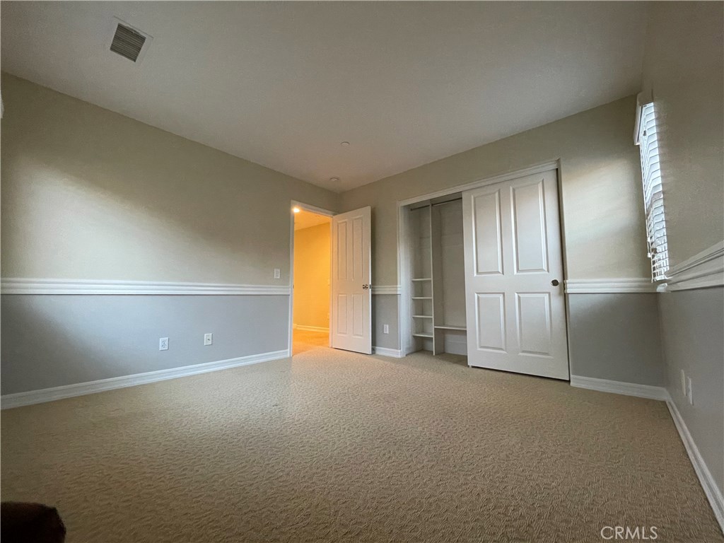 20 Arborside Irvine, CA 92603 - Photo 32 of 45 an empty room with a empty space and windows