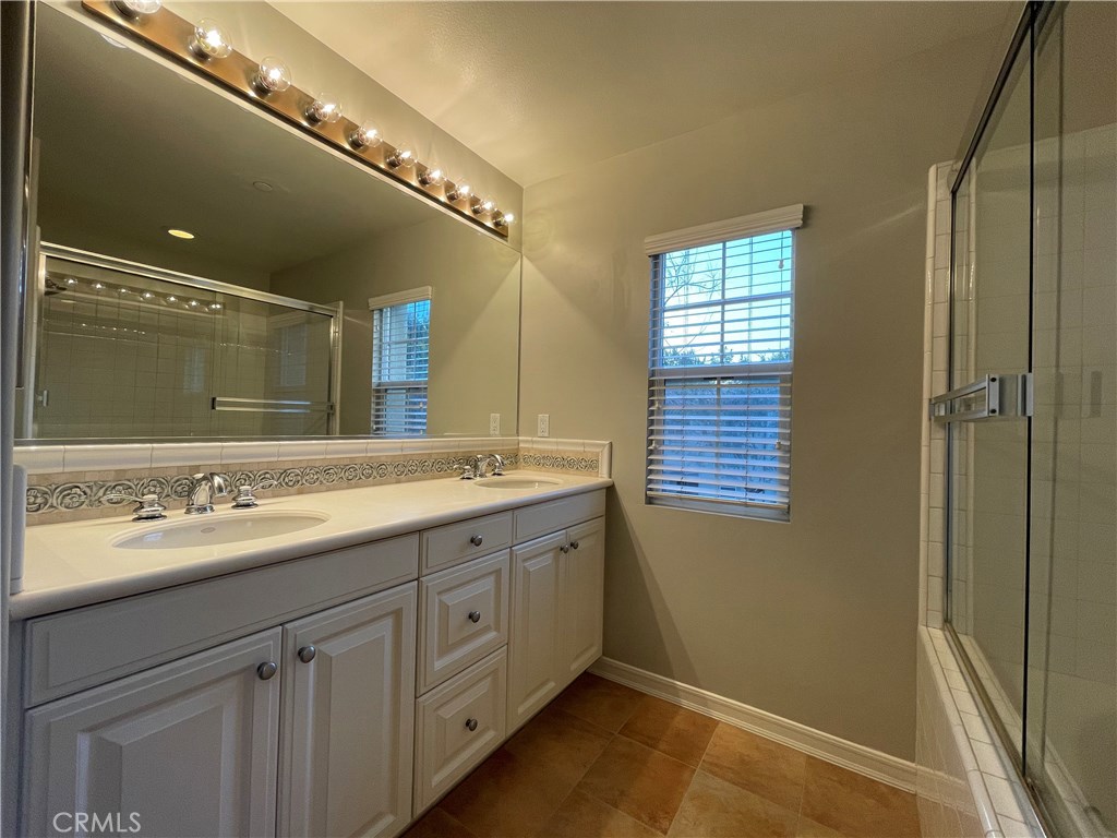 20 Arborside Irvine, CA 92603 - Photo 39 of 45 a bathroom with a double vanity sink and a mirror