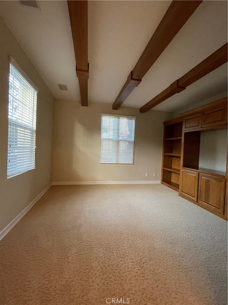 20 Arborside Irvine, CA 92603 - Photo 7 of 45 an empty room with a windows and cabinet