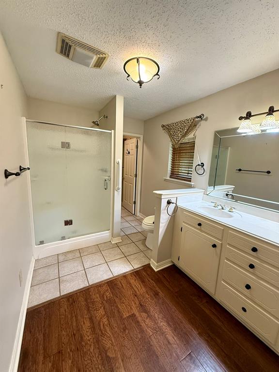 11535 Timber Ridge Drive Keithville, LA 71047 - Photo 20 of 39 a spacious bathroom with a double vanity sink a mirror and a shower