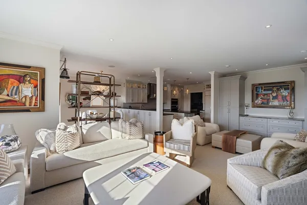 a living room with furniture and a rug